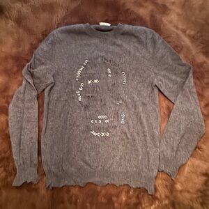 McQueen distressed with silver steel hoops in distressed skull front sweater.